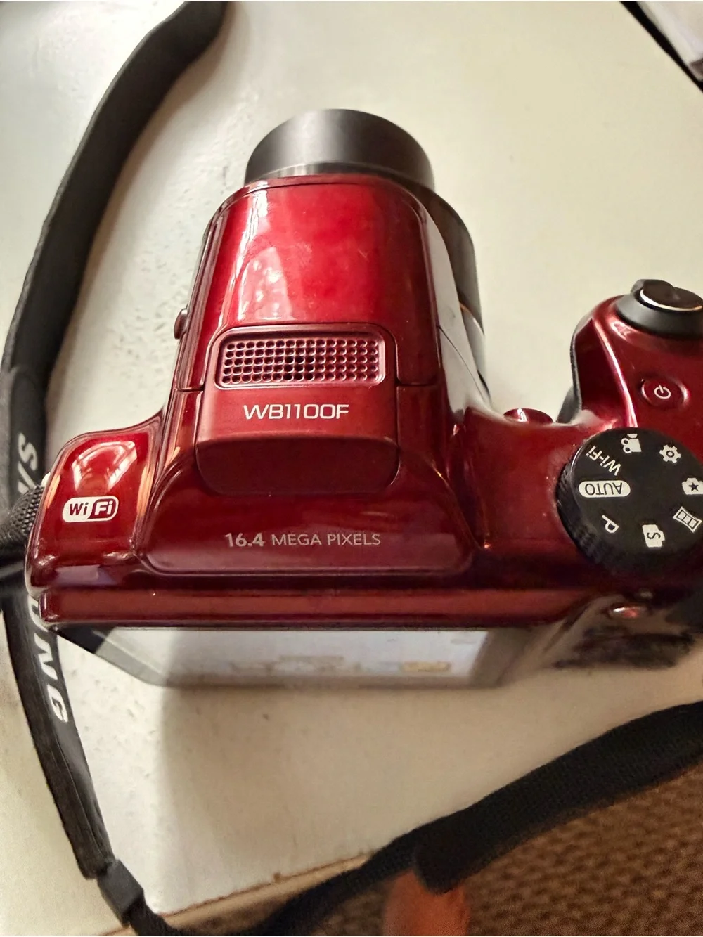 Samsung glossy red digital bridge camera with Samsung lens